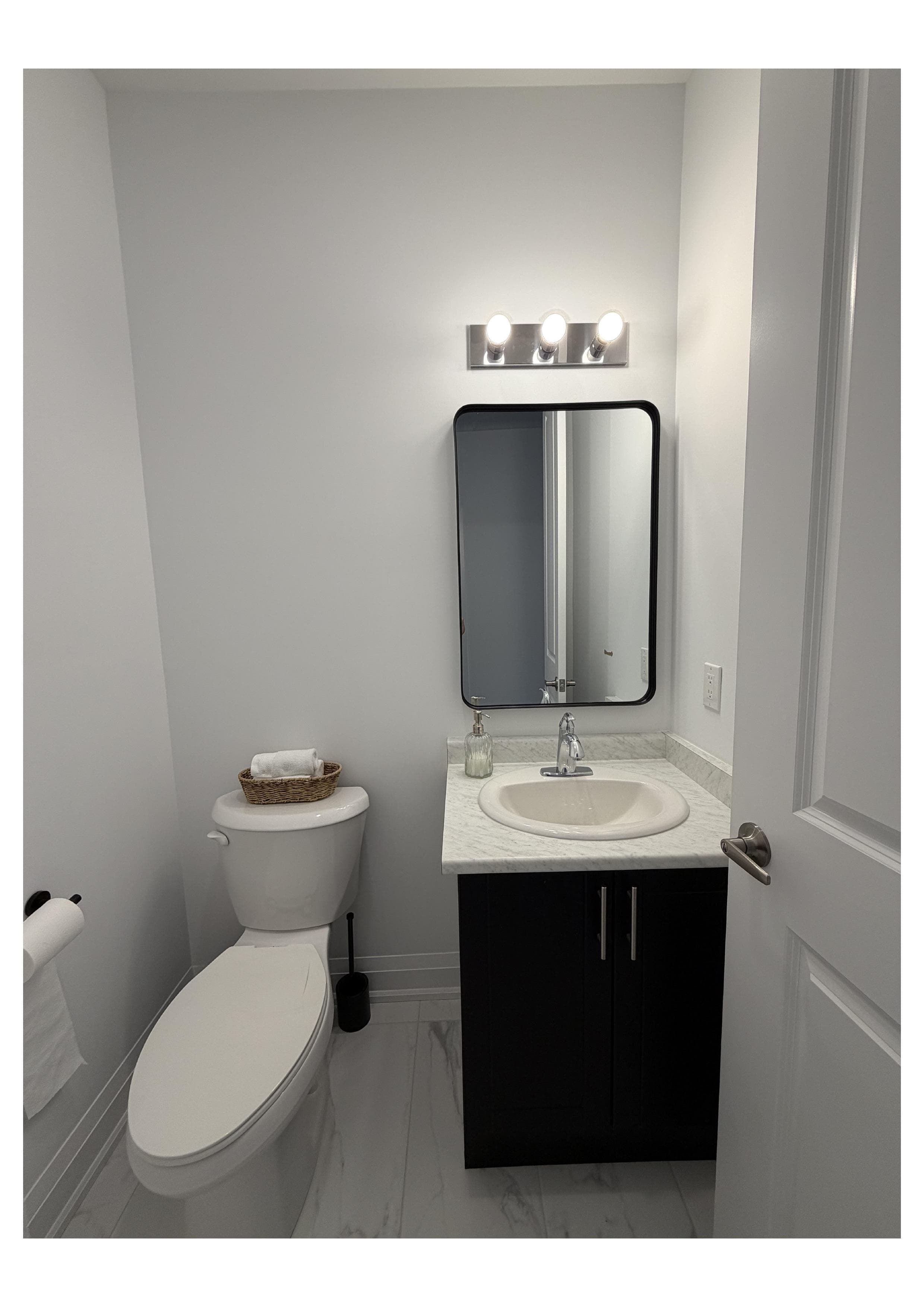 Powder room plumbing installation with toilet and vanity completed by Everline Plumbing