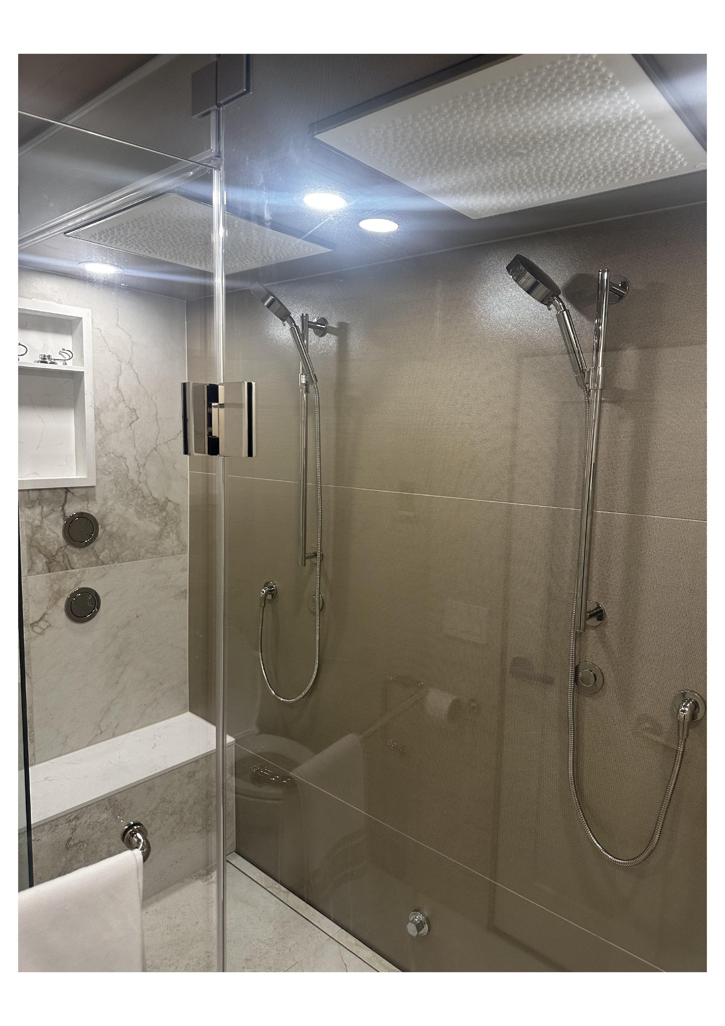 Luxury marble shower installation with rainfall shower head
